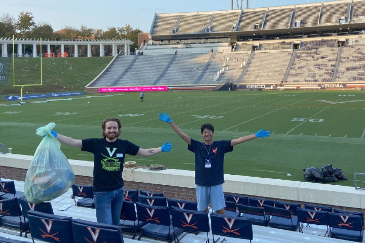 Student Employees Picking Up Trash at Football Stadium expressing "Yay"