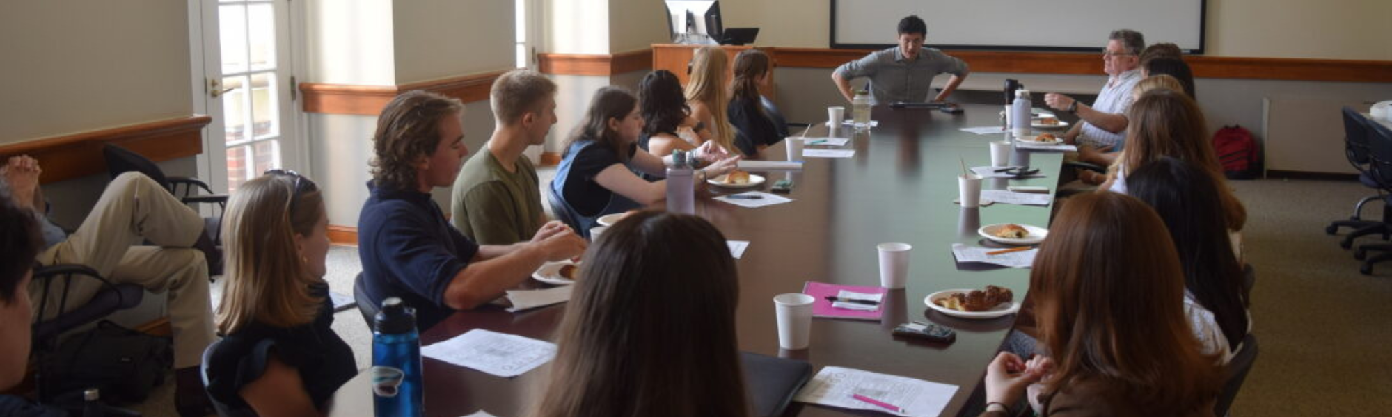 Decarbonization Academy students meeting around a table