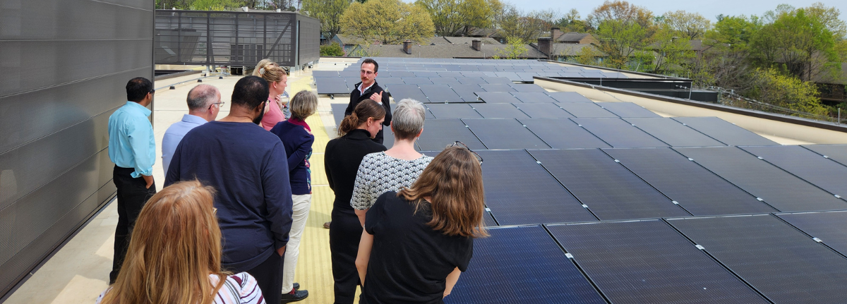 People on a solar panel roof talking