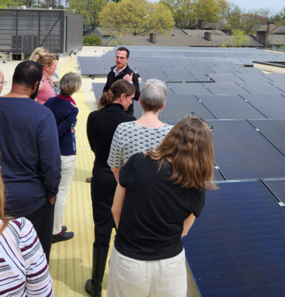 People on a solar panel roof talking