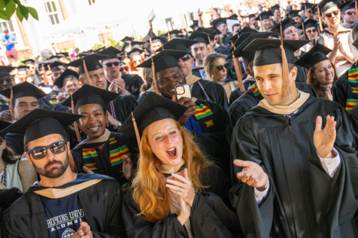 Students clapping at graduation
