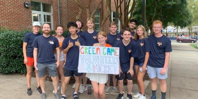 Student employees and volunteers gather before heading into Scott Stadium.