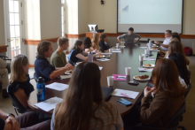 Decarbonization Academy students meeting around a table