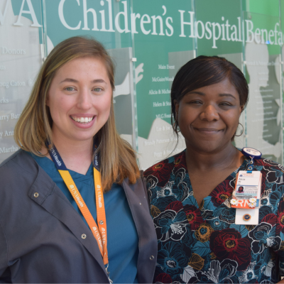 Tabatha Gilbert (left) and Alicia White (left) smiling and standing next to each other